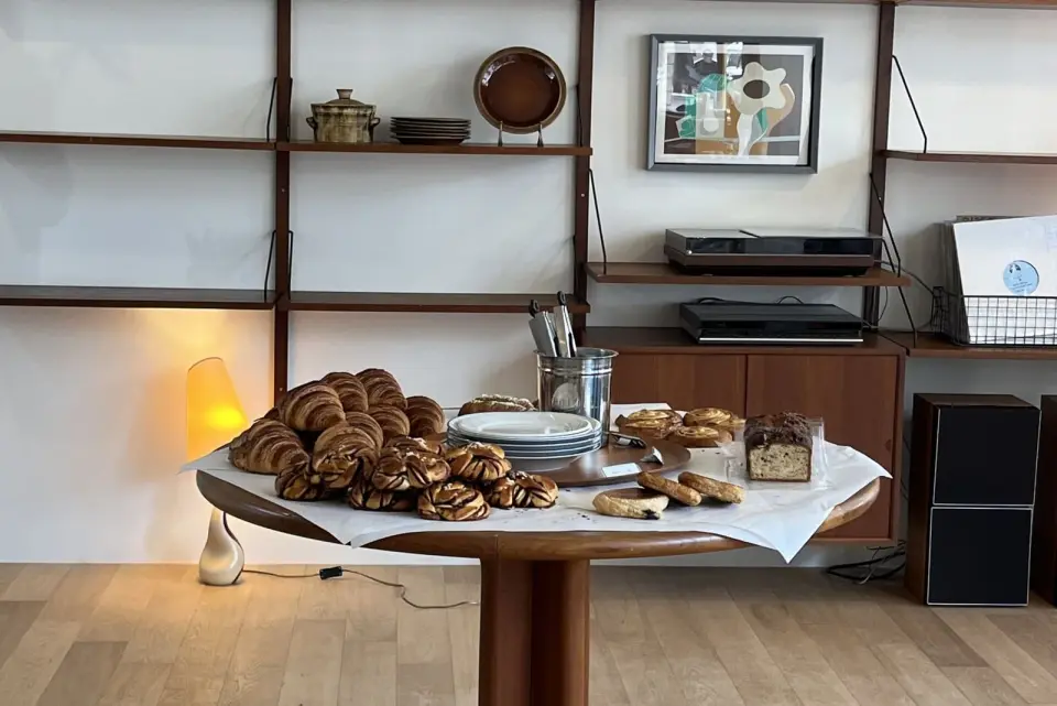 Cafe interior with pastries on a round wooden table